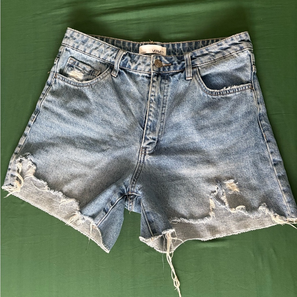 Medium wash distressed denim shorts
